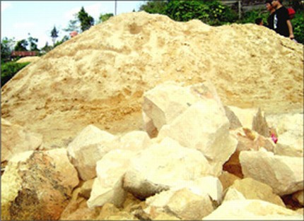  Sand pounded from exotic sandstone piled up on the roadside as seen in  October 2007  
