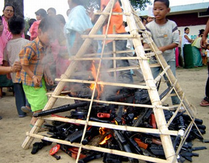 Denouncing the culture of violence in the State kids make a bonfire of their toy guns in June 2008