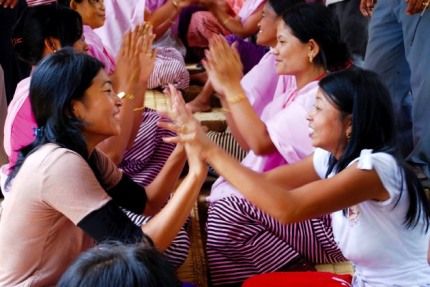Playing traditional rhyme game at Heingang Iputhou Marjing Community Hall in July 2009 