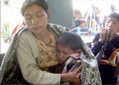 A Mother holds dearly to her child in December 2010