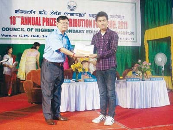Secretary of COHSEM, Dr Hamom Nabachandra handing over certificates and citation to meritorious students who excelled in the Higher Secondary Examination 2011