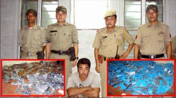 IE police with the seized drugs and the smuggler