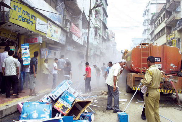 A fire tender near the shop which caught fire on August 25 at Thangal Bazar