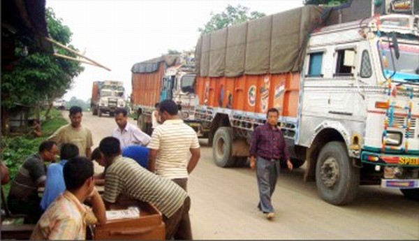 Trucks wait at the weigh in post at Jiribam
