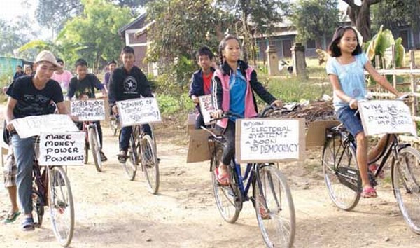 Boys and girls take out a cycle rally for Free and Fair Election