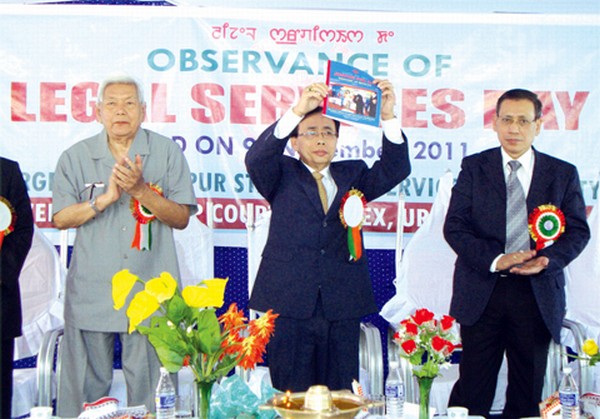 Retd Justice, Gauhati High Court, Maibam Binoy Kumar realeasing souvenir on the occasion of Legal Services Day