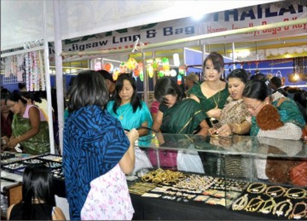 Visitors to the Sangai festival throng a stall