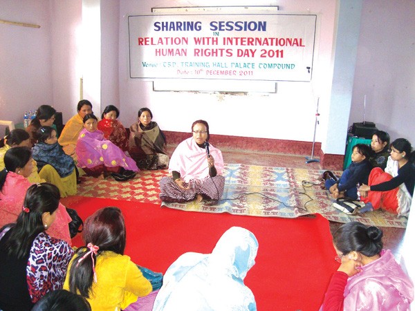 A woman speaking in the sharing session in Relation with International Human Rights Day 2011 at Palace Compound