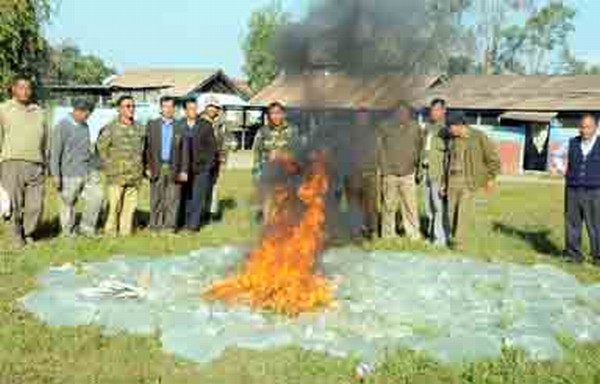 Excise personnel setting the liquor aflame