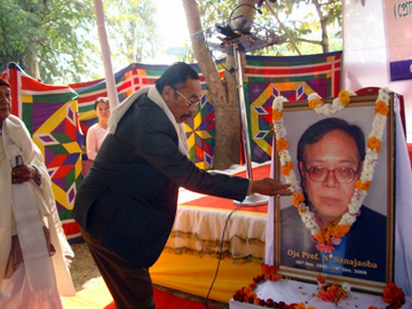Floral tributes  being paid to  late Prof Naorem Sanajaoba on his death anniversary