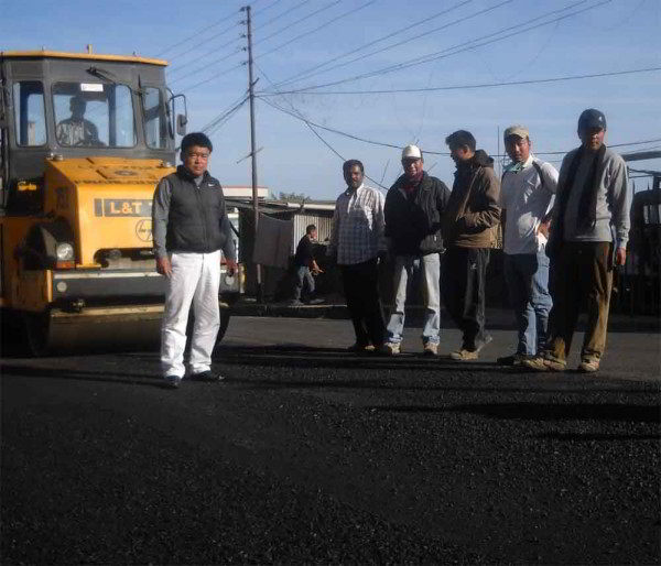 KC Angami (left) with his assistants monitoring and supervising ongoing TCP to IG Stadium Road Construction in high school area