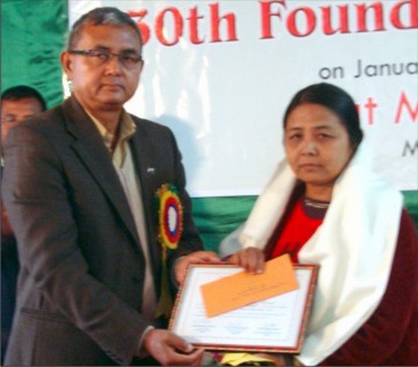S Aruna being conferred the award