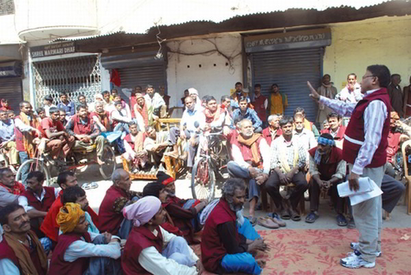 Non-local rickshaw pullers, Mutias and other labourers listening to a speaker during a protest demonstration staged as part of the nation-wide general strike on Tuesday