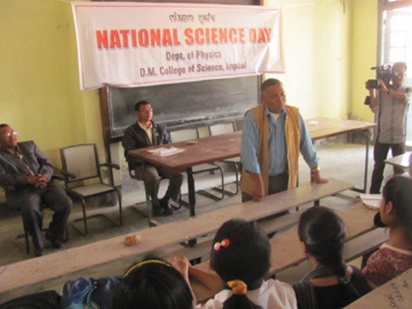 A resource person with students during National Science Day