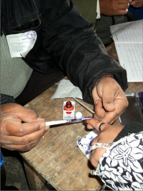 A voter getting inked