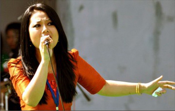A singer performs at the Zomi National Day
