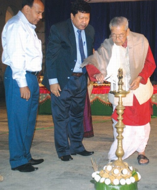 Musicologist Laishram Birendra lighting the ceremonial lamp to inaugurate a music concert organised by AIT, Imphal at BOAT