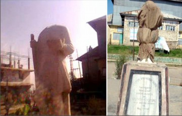 Headless statue and the covered up statue of Gandhi