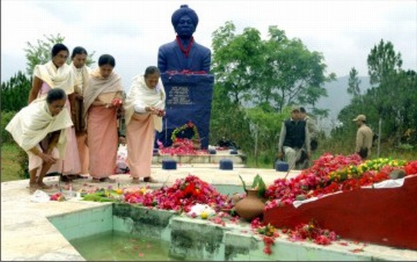 Elderly women offering floral tributes at the Martyrs' Park atop Cheiraoching