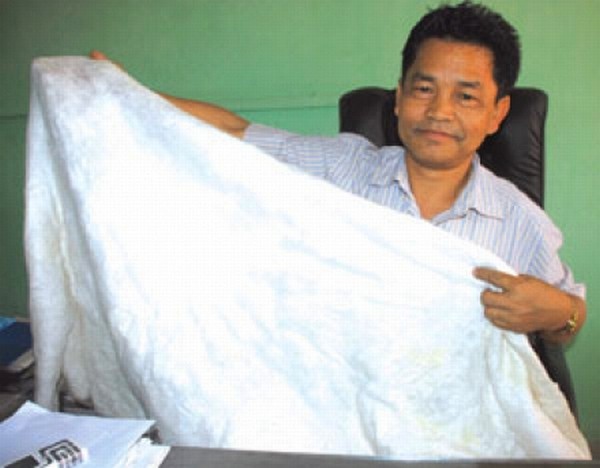 Dr Chaoba showing a cloth weaved by Eri silkworm