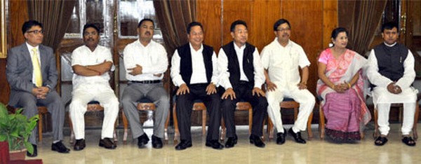 The eight new Ministers before their oath taking ceremony by the Governor Gurbachan Jagat at the Raj Bhavan durbar Hall.