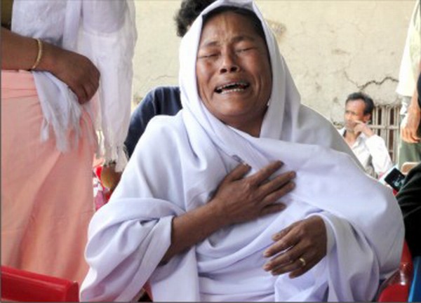A mother weeps for her missing son