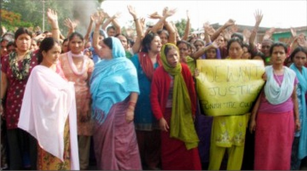 Womenfolk blocking the highway against the 'murder' of a girl