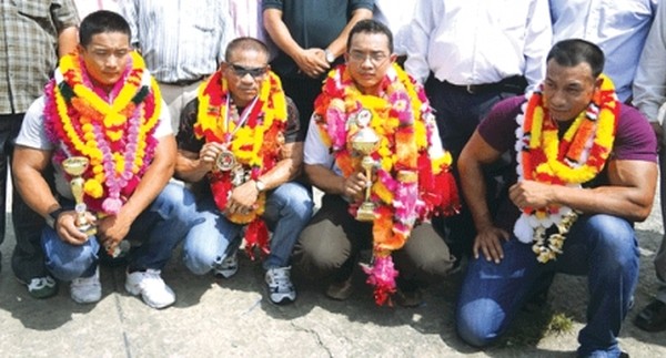 (L-R) Priyobrata (5th), Pradipkr (8th), London (Silver), Shaolin (9th) being feted on their arrival from Mr World Body Building Championships
