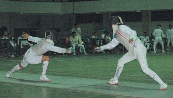 A fencing bout in the 8th Governors Cup State Level Fencing Championships 2012 being held at Khuman Lampak Sport Complex