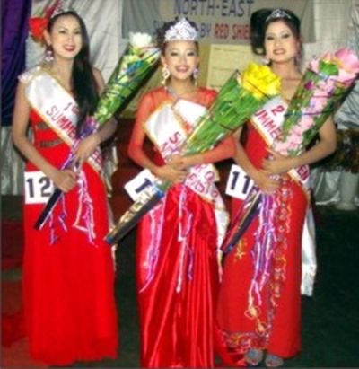 The winner flanked by the first and second runner up