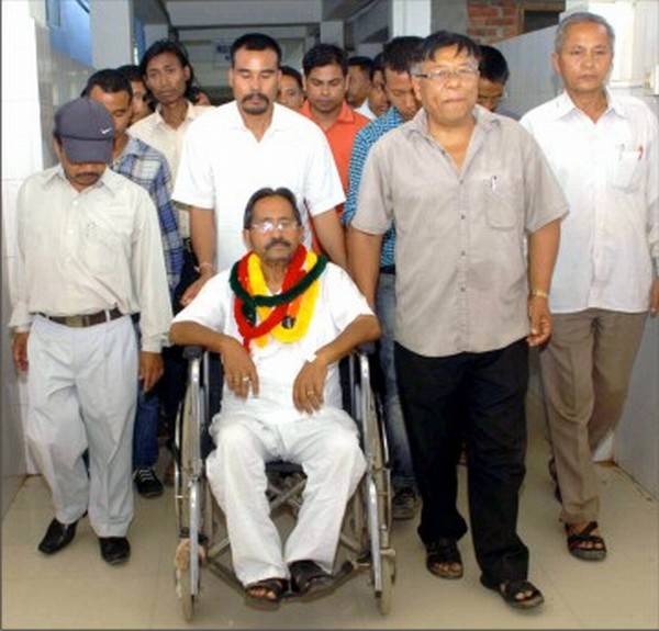 Birahari Sharma being wheeled out of JN Hospital security ward, where he was detained for staging fast-unto-death agitation
