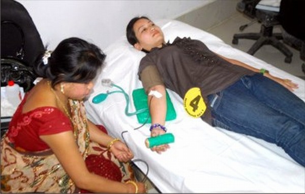 Picture of a young girl donating blood