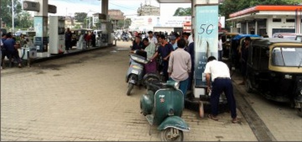 File picture of a queue at a petrol pump, a common sight in Imphal now