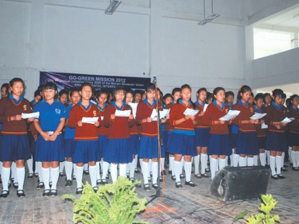 Students singing the welcome songs, (inset )sapling being planted to kick off Go-Green Mission, 2012 of Maram Students' Union at Senapati district