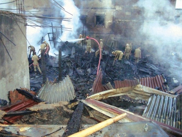 Fire fighters dousing a devastating fire that broke at Yaiskul Janamasthan, Imphal which left three furniture shops and houses completedly gutted in the wee hours of July 17, 2012