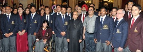 The feted sportspersons and coaches with the President