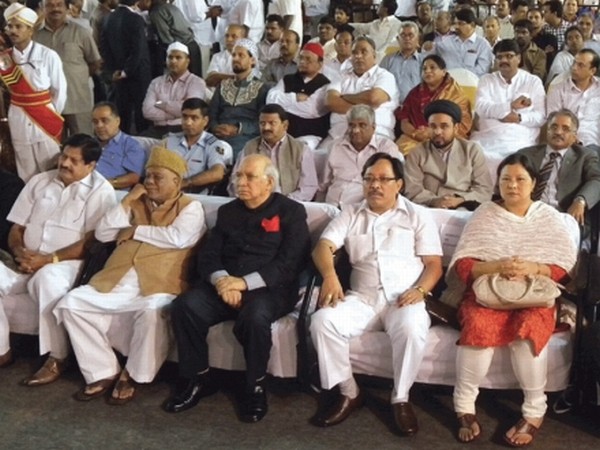 Minister Dr Ratankumar sitting next to Karnataka Governor HR Bharadwaj during an Eid Milan function