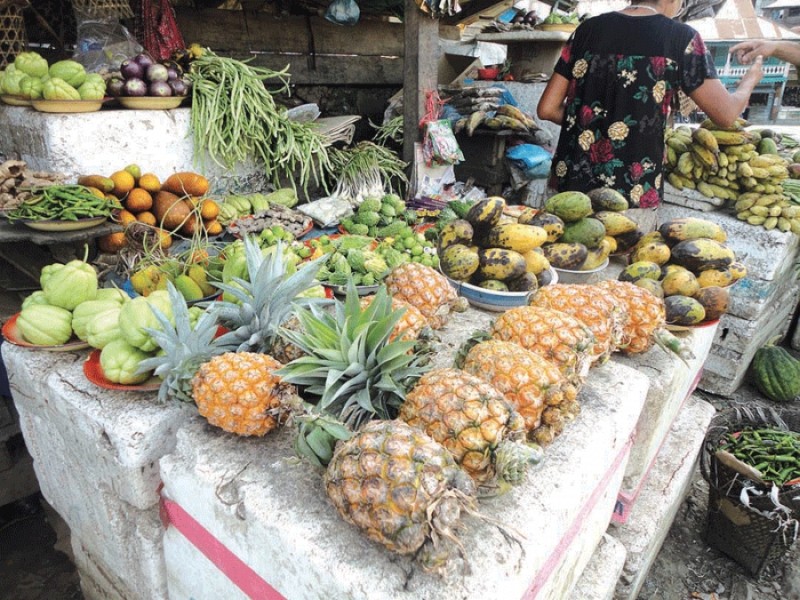 Fruits and vegetables being put up for sale in a roadside stall at Jessam