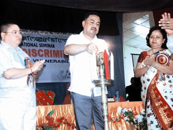 Education Minister, M.Okendro lighting the candle to inaugurate a seminar at S.Kula Women's College, Nambol
