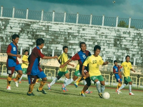 Players of JSYC (yellow) and ESU (blue & red) vying for the ball during a match of the 7th Manipur State League organised by All Manipur Football Association at Mapal Kangjeibung, Imphal on Wednesday, September 19, 2012