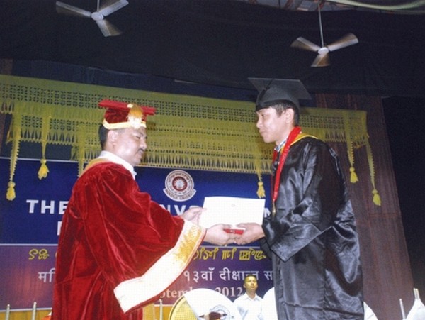  Education Minister M Okendro giving away certificate to successful student during the 13th convocation of Manipur University 