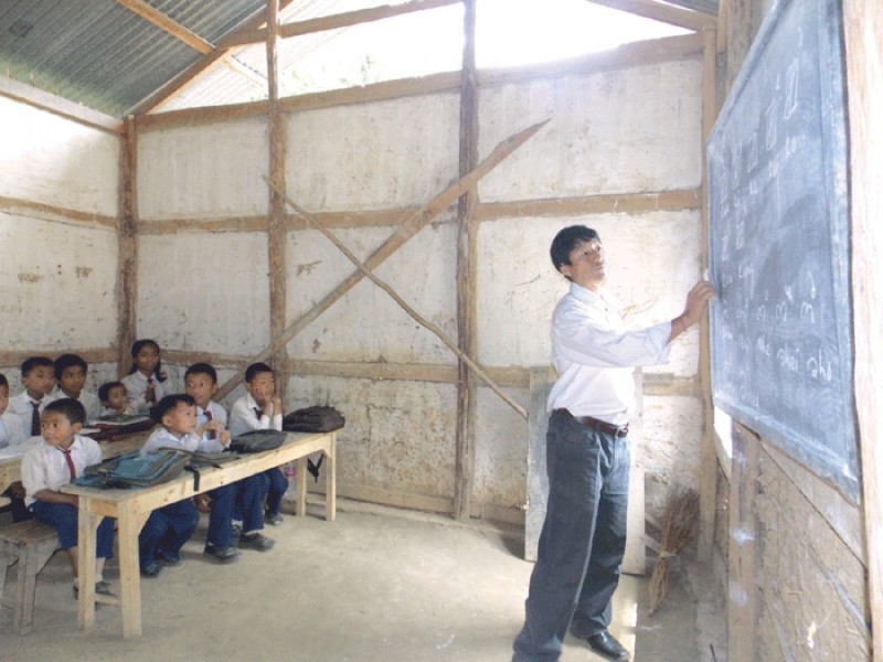 KS Angdun Maring teaching Meetei Mayek to his students in the village School