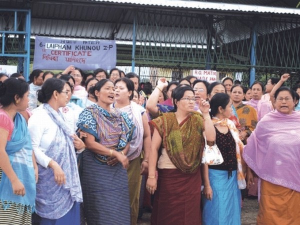 Supporters of a woman candidate for Laipham Khunou Zilla Parishad shouting slogans against alleged malpractice of RO