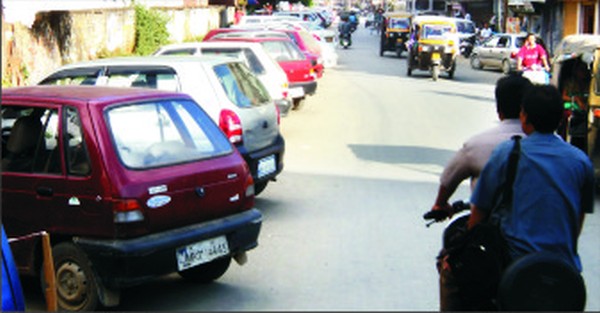Vehicles parked on either side of RIMS road