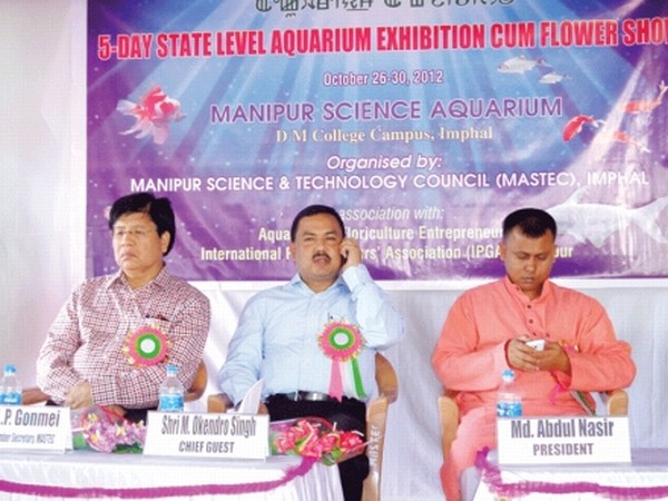 Dignitaries are seen busy attending to phone calls during the inauguration of Aquarium Exhibition cum Flower Show at Manipur Science Aquarium
