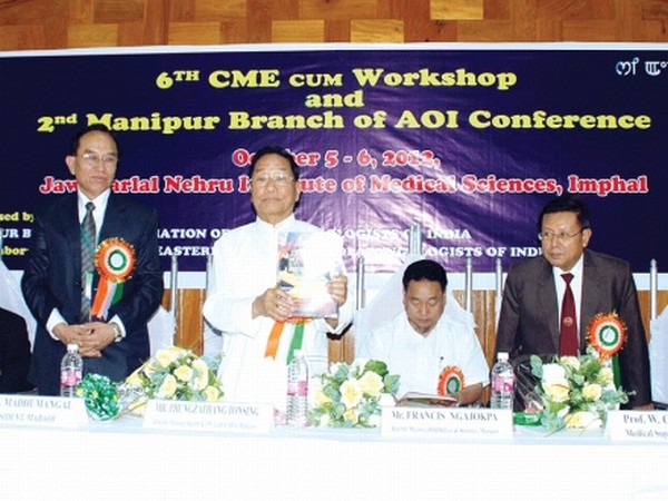 Health Minister Phungzathang releasing a souvenir to mark AOI meet