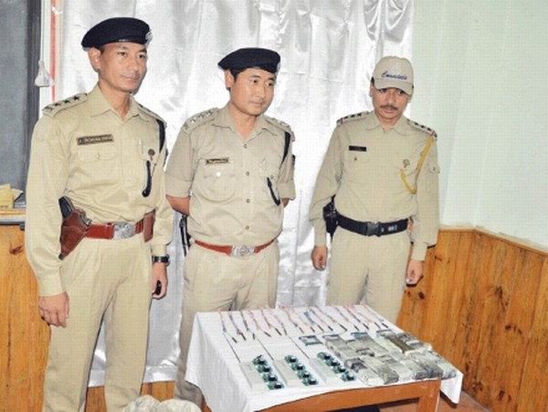 Imphal West Police Commandos displaying the seized explosive materials