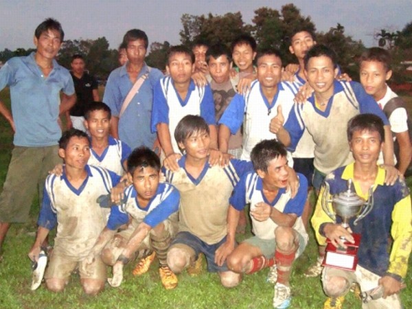 Kapakhal Youth Club players and officials celebrating after they won the champion's trophy of the 2nd S Gourababu Memorial 3rd Division Football League at Jiribam