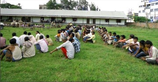 File picture of migrant workers waiting for their turn during a document verification drive.