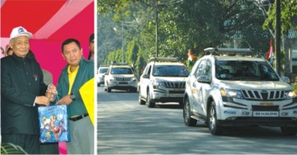 The car rally entering Imphal and the CM receiving one of the participants